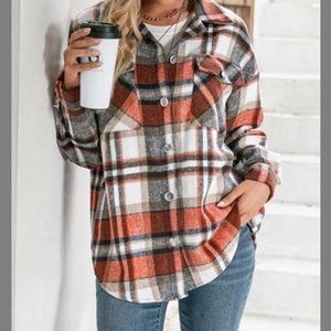 Plaid orange and white shirt jacket.